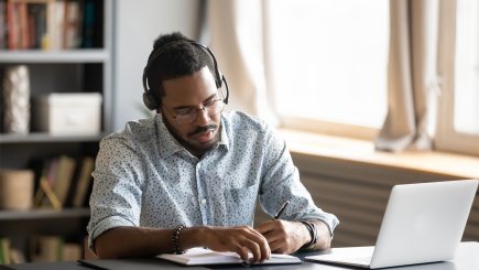 man working from home online