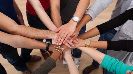 Hands coming together