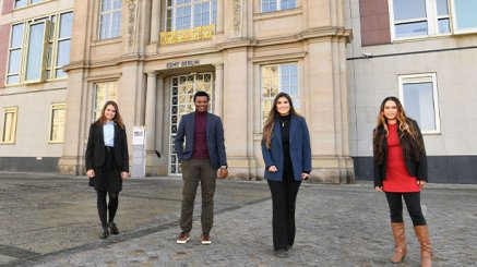 4 MIM students standing in fron of the ESMT building 