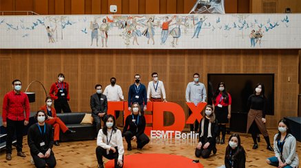 ESMT students wearing masks at TEDx event. 