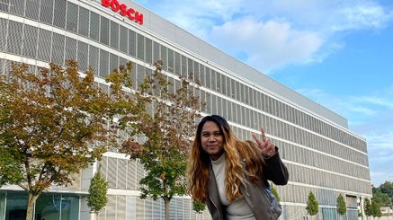 Radhika Rajvanshi standing outside Bosch building