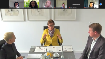  people in a meeting with student attending online 