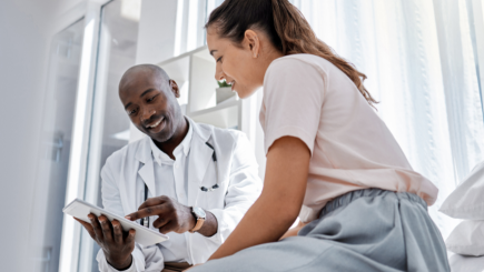 A doctor shares information with a patient