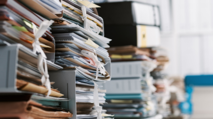 A big amount of files on a desk.