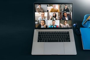 9 people on a zoom call on a laptop